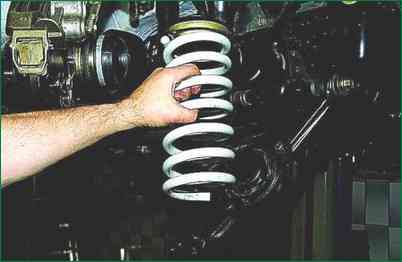 Replacing the front suspension spring of a Chevrolet Niva car